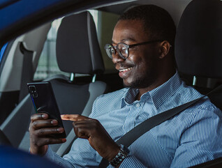 Person accessing phone in vehicle