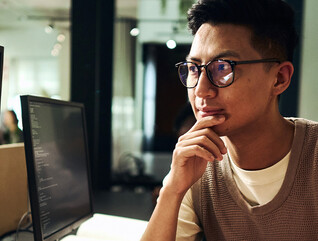 Computer programmers working on code
