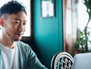 Person using laptop at home