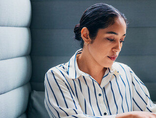 Person working on laptop in office