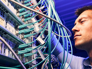 Engineer testing cables