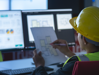 state government construction worker works at computer