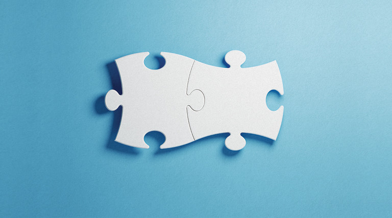 Puzzle pieces fitting together perfectly