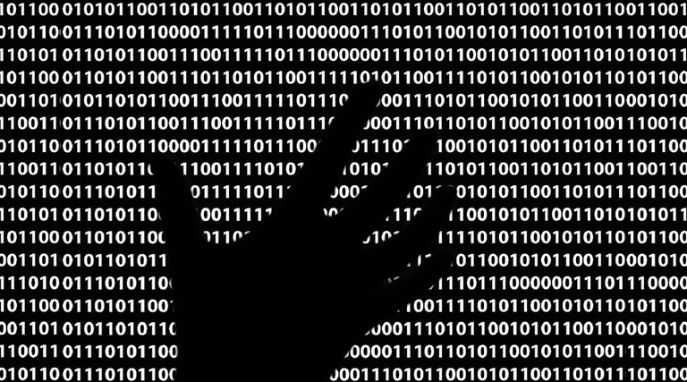 Ominous black hand in lines of code
