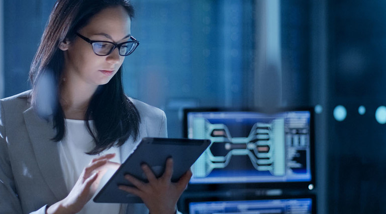 Young Female Government Employee Wearing Glasses Uses Tablet in System Control Center. 