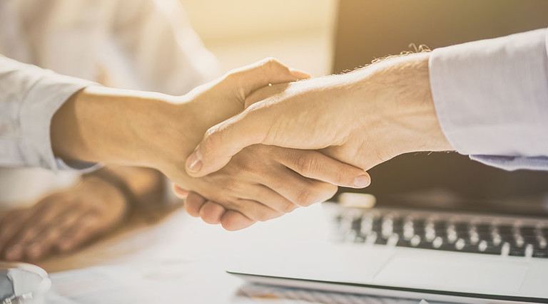 Business people shaking hands. Finishing up meeting.
