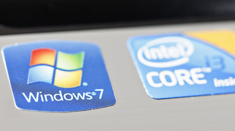 Windows and Intel stickers on laptop computer