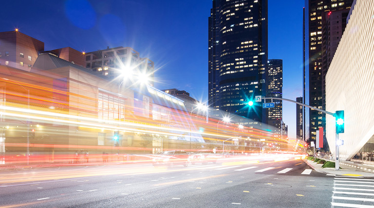 smart city digital traffic on a LA street at night 