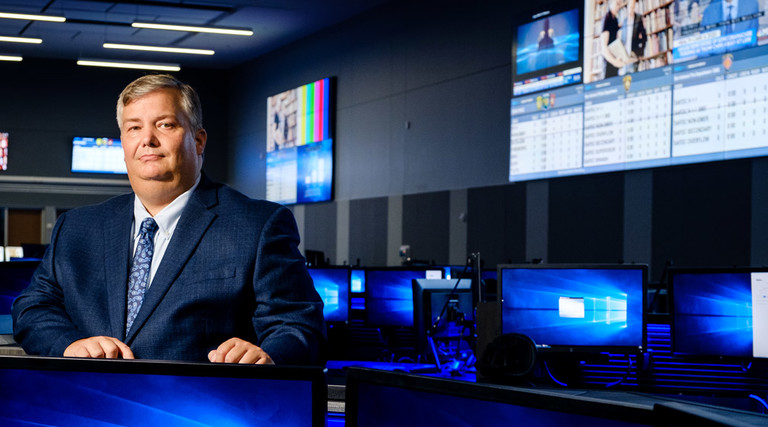 Brett Schneider, Executive Director of the Bexar Metro 911 Network, manages a state-of-the-art facility with robust audio and visual communications.