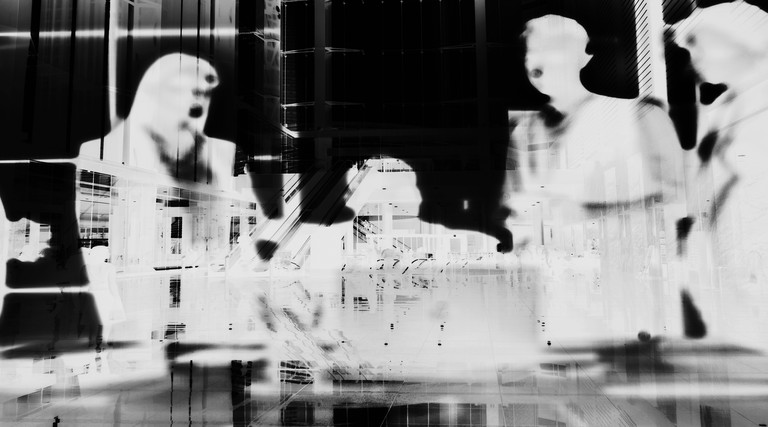 Negative image of people in a meeting