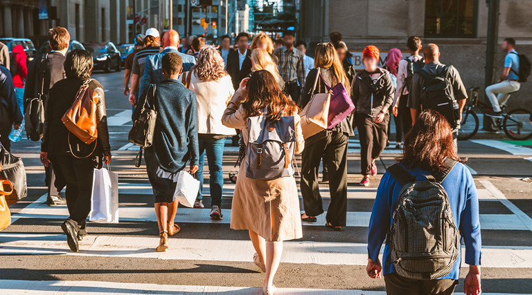 A group of people crossing the street