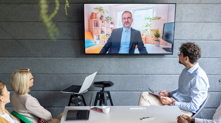 People holding a hybrid meeting