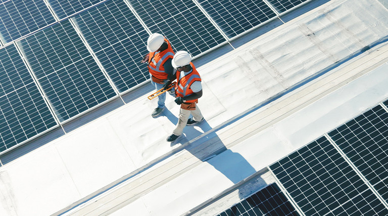 Solar panel team surveying