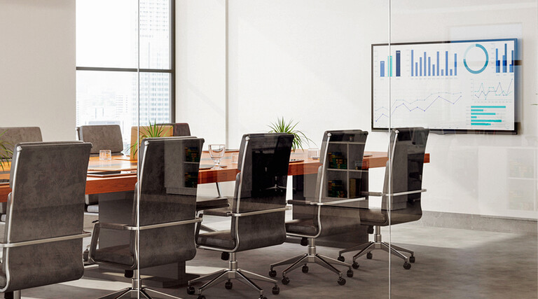 Outside View Of Empty Meeting Room With Table And Office Chairs