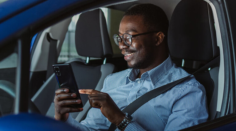 Person accessing phone in vehicle