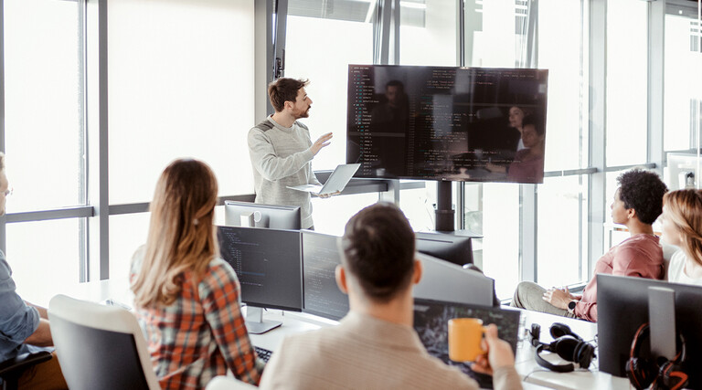 People learning coding on the job