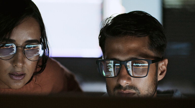 Coworkers reviewing code