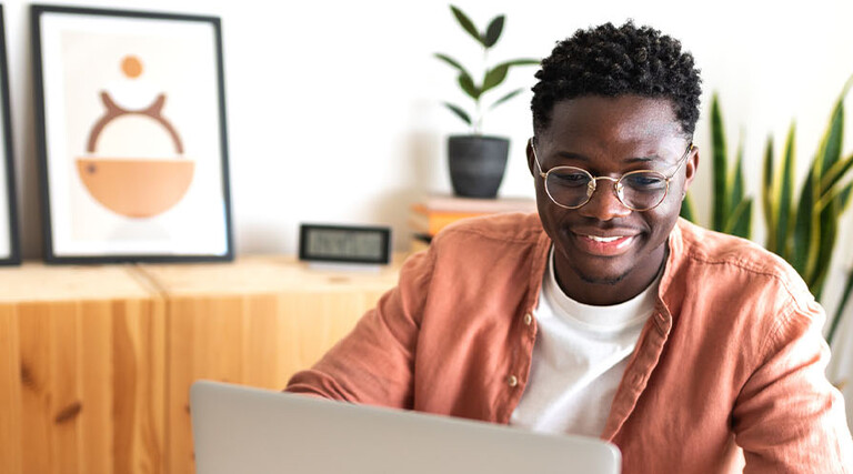 Person using laptop at home