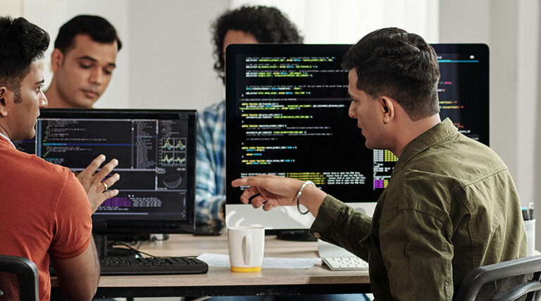 Developers Discussing Programming Code