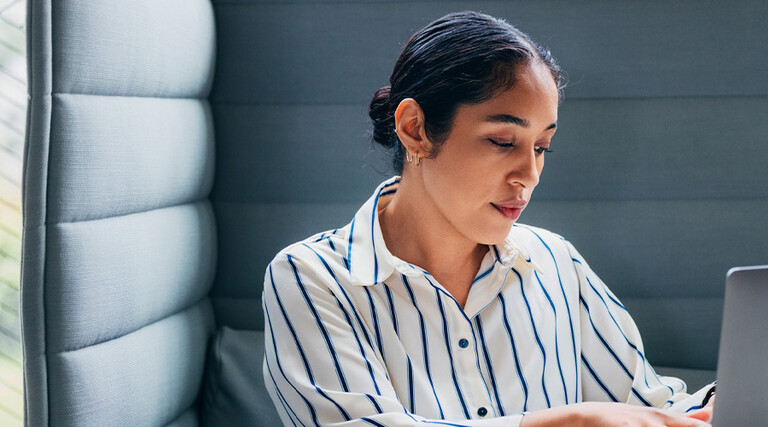 Person working on laptop in office