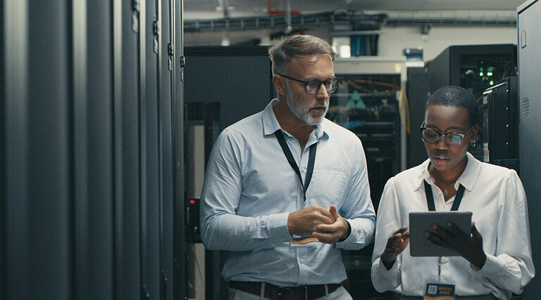 Technicians collaborating in office