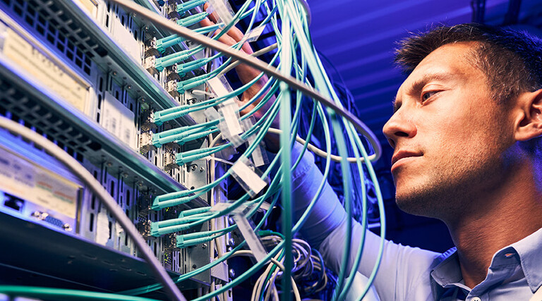 Engineer testing cables