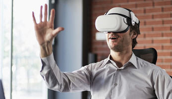 Person using VR to attend meeting