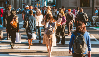 A group of people crossing the street