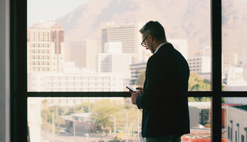 Person using phone in office