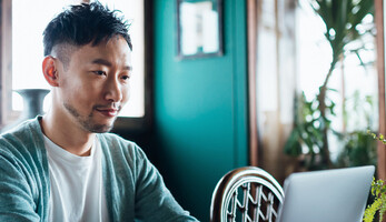 Person using laptop at home