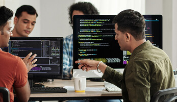 Developers Discussing Programming Code