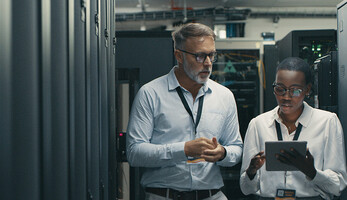 Technicians collaborating in office