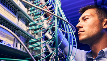 Engineer testing cables