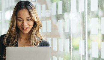 Person holding laptop