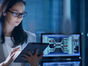 Young Female Government Employee Wearing Glasses Uses Tablet in System Control Center. 
