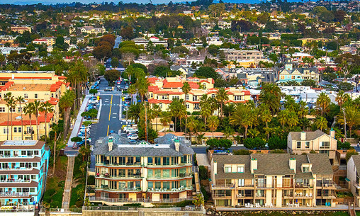Aerial view of condos lining the beach in the northern San Diego community of Carlsbad, California.