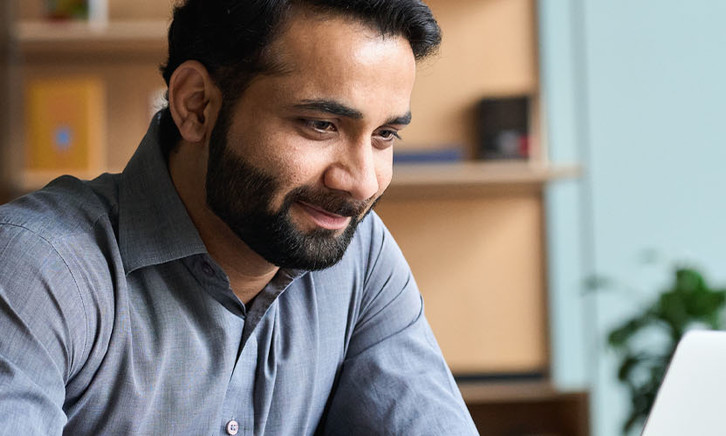 Person using computer in home office