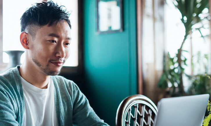 Person using laptop at home