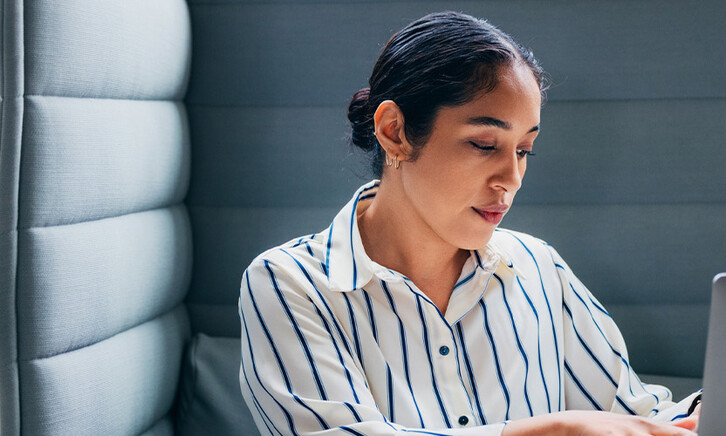 Person working on laptop in office