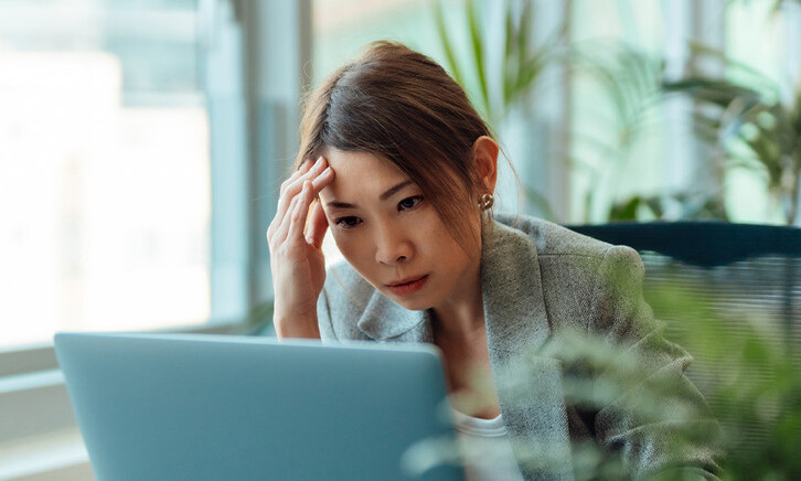 Frustrated person using computer