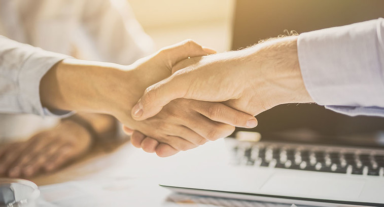 Business people shaking hands. Finishing up meeting.