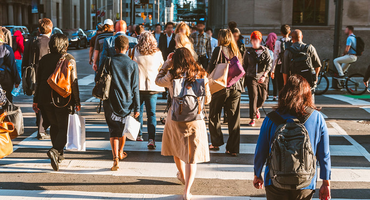 A group of people crossing the street