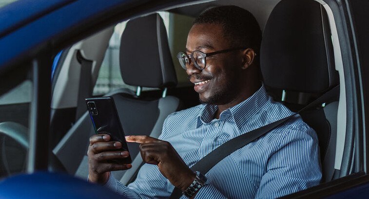 Person accessing phone in vehicle
