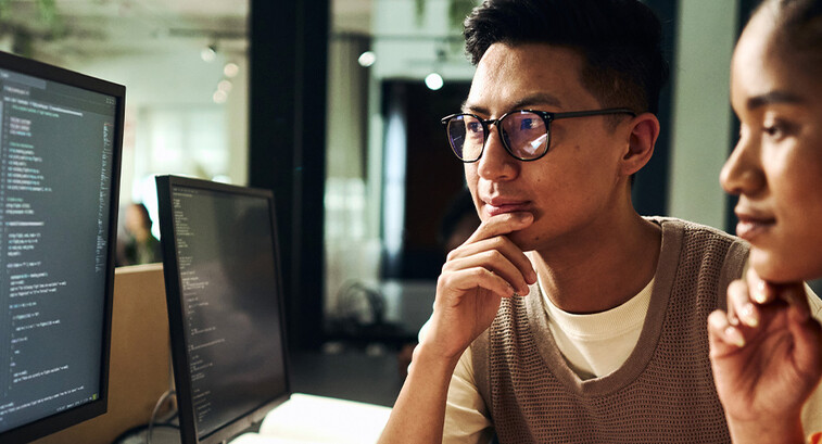 Computer programmers working on code