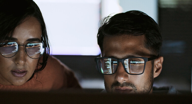 Coworkers reviewing code