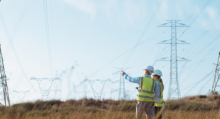 Utility workers examining power lines