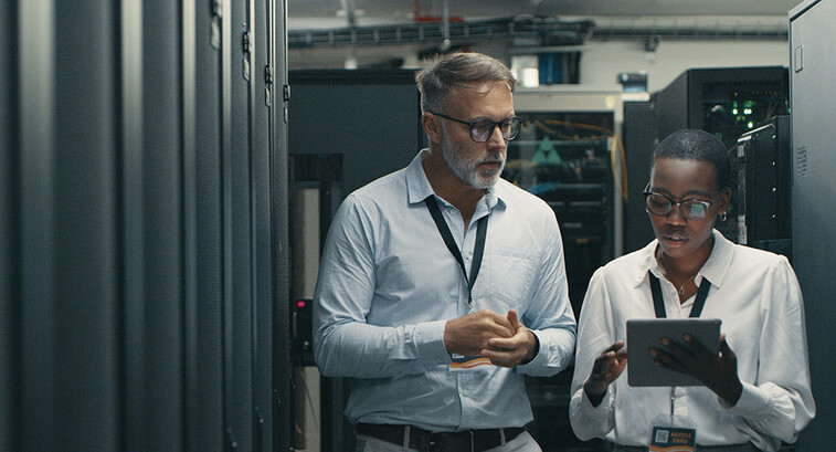 Technicians collaborating in office