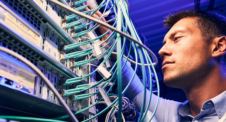 Engineer testing cables