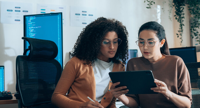 Coworkers viewing tablet
