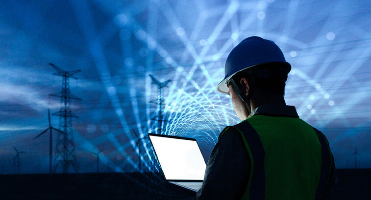 workman with laptop and data lights in the sky